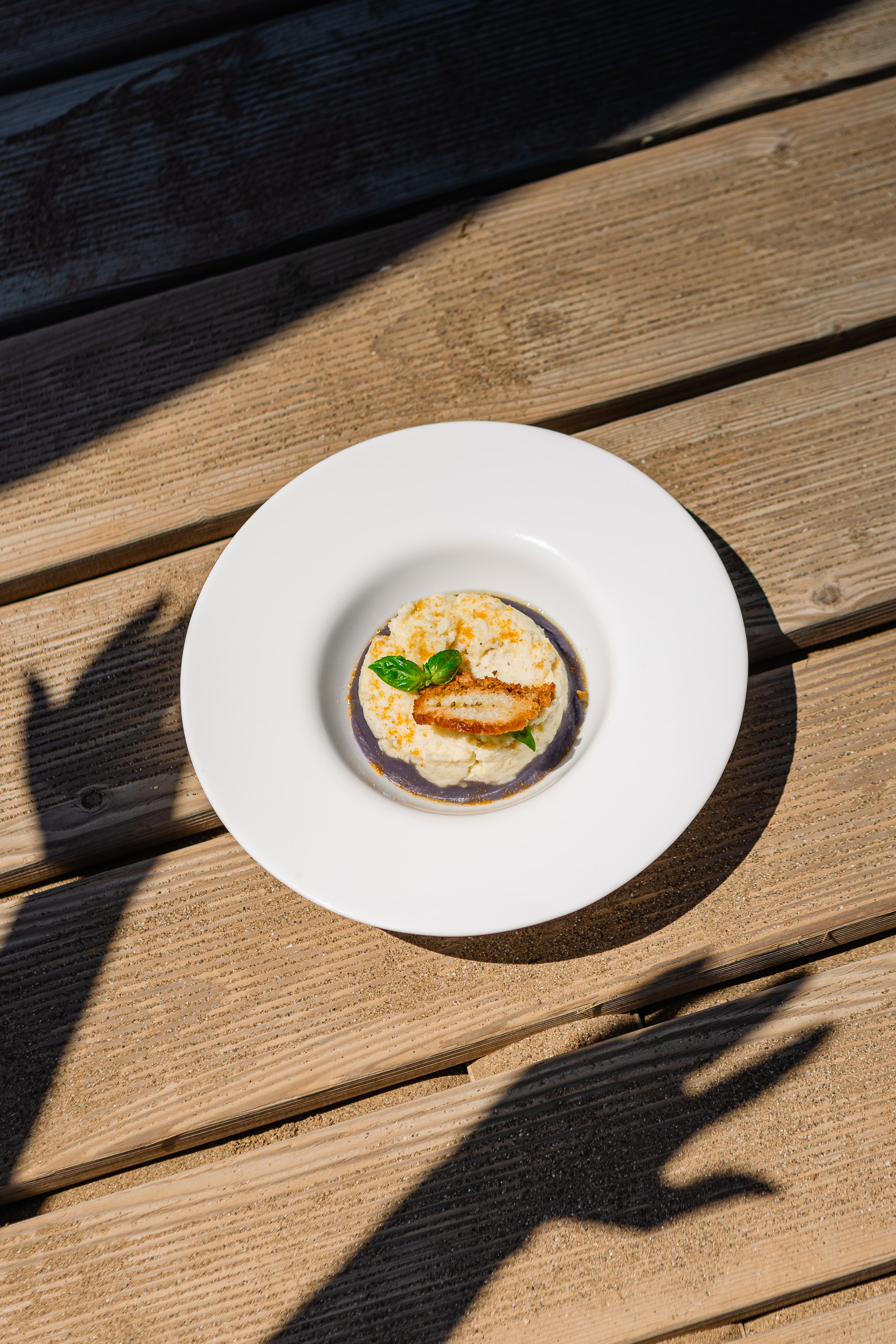 Baccalà mantecato su crema di patate viola